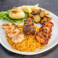 Kabob Trio · 3 grilled kabobs, Cajun shrimp, bacon wrapped scallops & filet tips with peppers, onions & t...