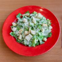 Caesar Salad  · Green salad with Caesar dressing and cheese. 