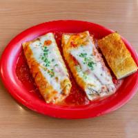 Spinach Manicotti · Pasta rolled and stuffed with ricotta and mozzarella cheese, marinara sauce and Parmesan che...