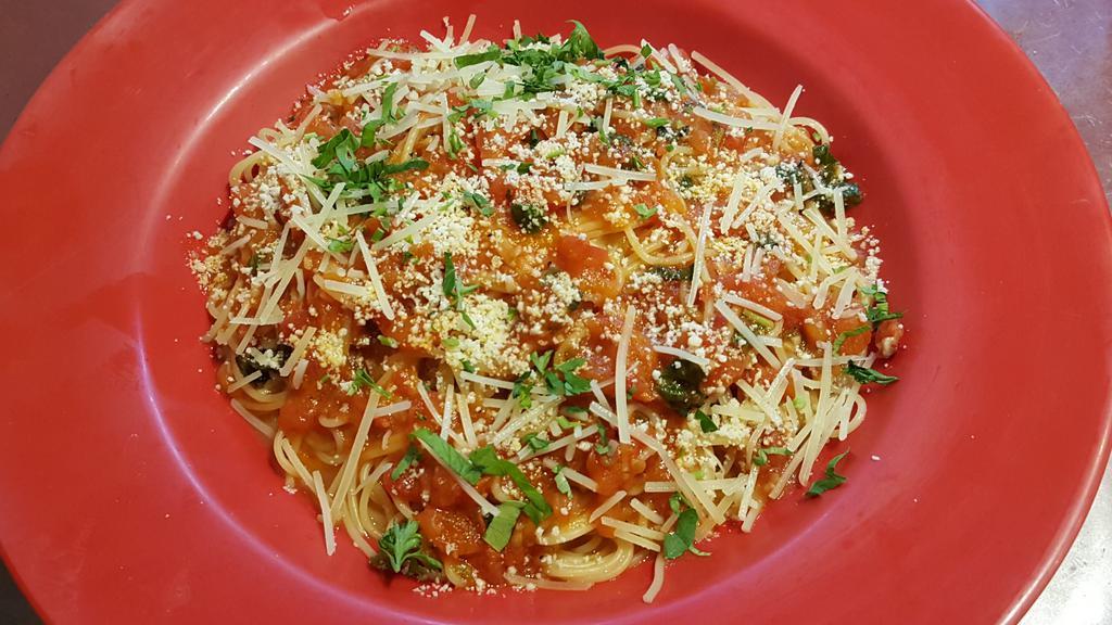 Capellini Pomodoro Pasta · Fresh tomato, garlic, basil and olive oil, capellini pasta and Parmesan cheese.