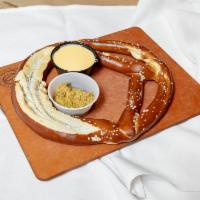 Giant Bavarian Pretzel · Cheese sauce, spicy beer-infused mustard.
