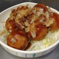 Tako Yaki (6 Pieces) · Deep-fried octopus balls. Topped with bonito flakes and unagi sauce.
