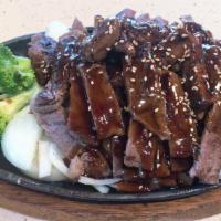 Beef Teriyaki Entree · Grilled beef strips over onions and broccoli with teriyaki sauce and sesame seeds.
Served wi...