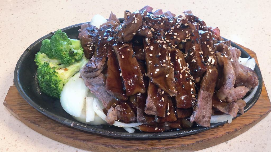 Beef Teriyaki Entree · Grilled beef strips over onions and broccoli with teriyaki sauce and sesame seeds.
Served with miso soup, salad, and steamed rice.