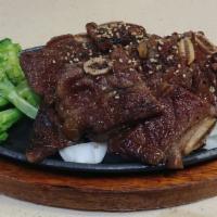 Beef Short Ribs Entree · Grilled pre-marinated bbq beef short ribs over onions and broccoli with sesame seeds.
Served...