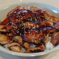 Chicken Teriyaki Donburi · Grilled boneless chicken over steamed rice with teriyaki sauce and sesame seeds. Served with...