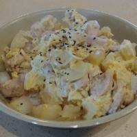 Oyako Don · Simmered chicken scrambled with eggs and onions with sesame seeds over steamed rice. Served ...
