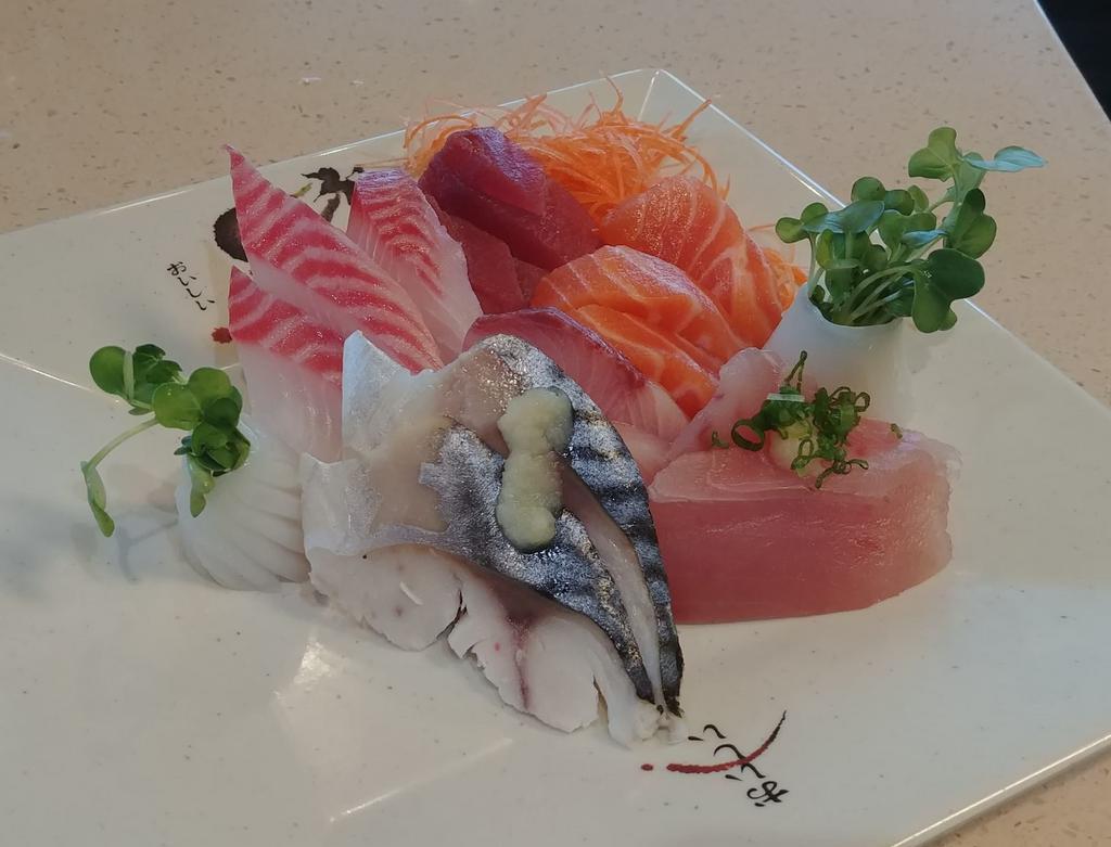 18 Piece Sashimi Deluxe · 18 pieces chef-choice sliced sashimi. Served with miso soup, salad, and steamed rice.