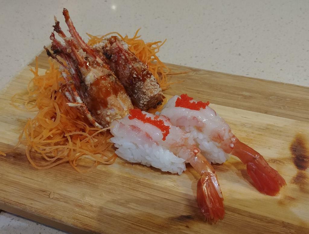 Ama -Ebi Nigiri · Sweet shrimp, sushi rice, masago, deep-fried shrimp head.