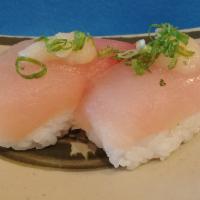 Shiro Maguro Nigiri · White tuna, garlic paste, scallion, sushi rice.