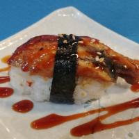 Unagi Nigiri · Broiled eel, sushi rice, sesame seeds, seaweed, unagi sauce.