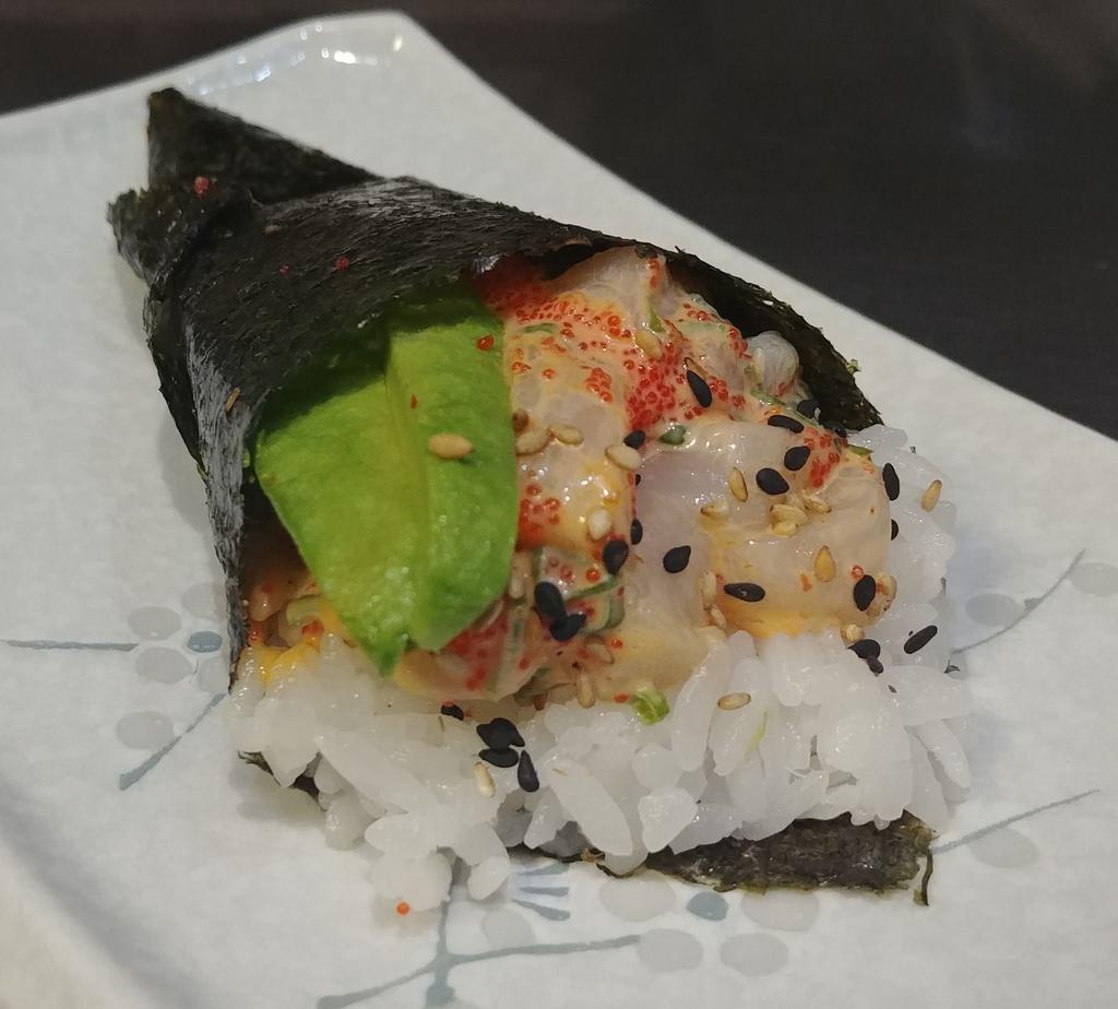 Spicy Scallop Hand Roll · Spicy scallop, avocado, sushi rice, seaweed, masago, spicy mayo sauce, sesame seeds.