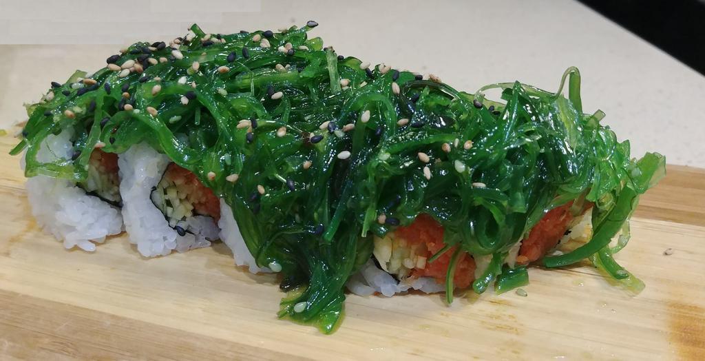 Poki Roll · In: Spicy Tuna, Cucumber
Out: Wakame, Sesame Seeds
Sauce:
