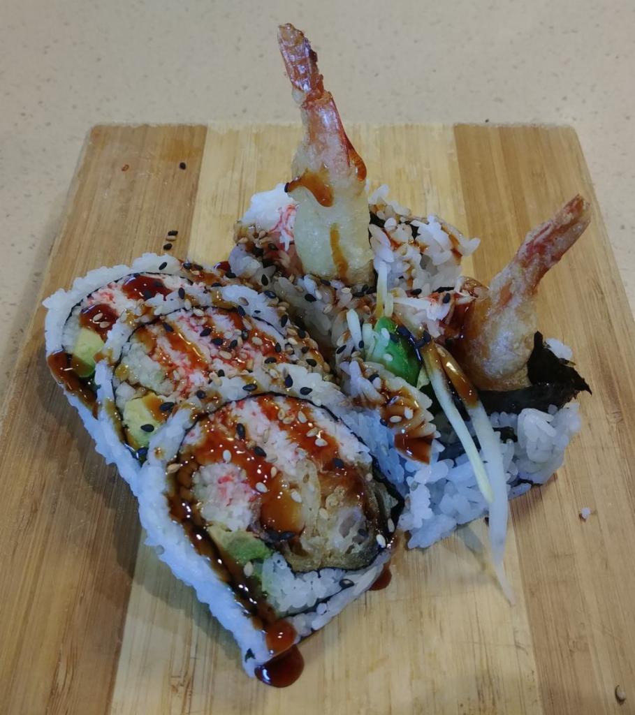 Shrimp Tempura Roll · In: Shrimp Tempura, Avocado, Cucumber, Crab
Out: Sesame Seeds
Sauce: Unagi