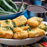 6 Pieces Paneer Pakora · Home made cheese with Indian spices and chick pea batter.