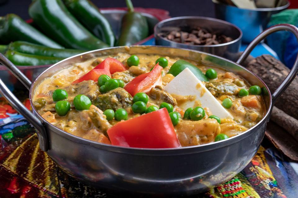 Navrattan Korma · Mixed vegetables cooked with mild creamy sauce flavored with nut and spices.