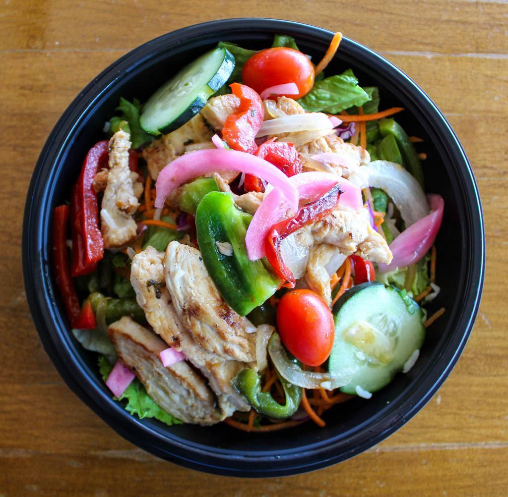 Fajita Salad · Choice of fajita chicken or fajita beef with grilled onions and peppers, topped with queso. Gluten free.