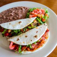 Veggie Tacos · Grilled mushrooms, onions, zucchini, squash, bell peppers in a spicy or mild Mexican sauce o...