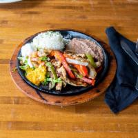 Chicken Fajitas · Marinated chicken, grilled with onions and bell peppers. Served with rice, beans, pico de ga...