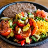 Veggie Fajitas · Grilled mushrooms, zucchini, squash, tomatoes, onions, and bell peppers. Served with pico de...