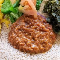 Ye' Misir Wot No 1 · Red Lentil simmered in Ethiopian spiced powdered Chili Pepper, fresh Garlic, Tomato sauce, O...