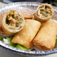 Southwestern Chicken Egg Rolls · Chicken, beans, corn, onion, spinach, jalapeno and cheese.