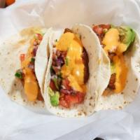 Fish Tacos · Avocado, pico de gallo, lettuce and boom boom sauce.