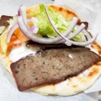 Gyro Sandwich · Choice of (Lamb & Beef) or (Chicken). Served on pita bread with Lettuce, Tomato, Onion & Tza...