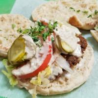 Falafel Sandwich · Lettuce, Tomatoes, Tzatziki Sauce, Parsley, Pickles, Tahini. Served on Pita