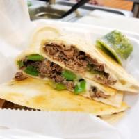 Philly Steak Quesadilla · Grilled Steak, Cheese, Green Pepper, Onion with Salsa Verde & Sour cream on the side