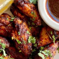 BBQ STYLE CHICKEN WINGS · Served with your choice of cool ranch, spicy buffalo ranch, or creamy blue cheese dipping sa...