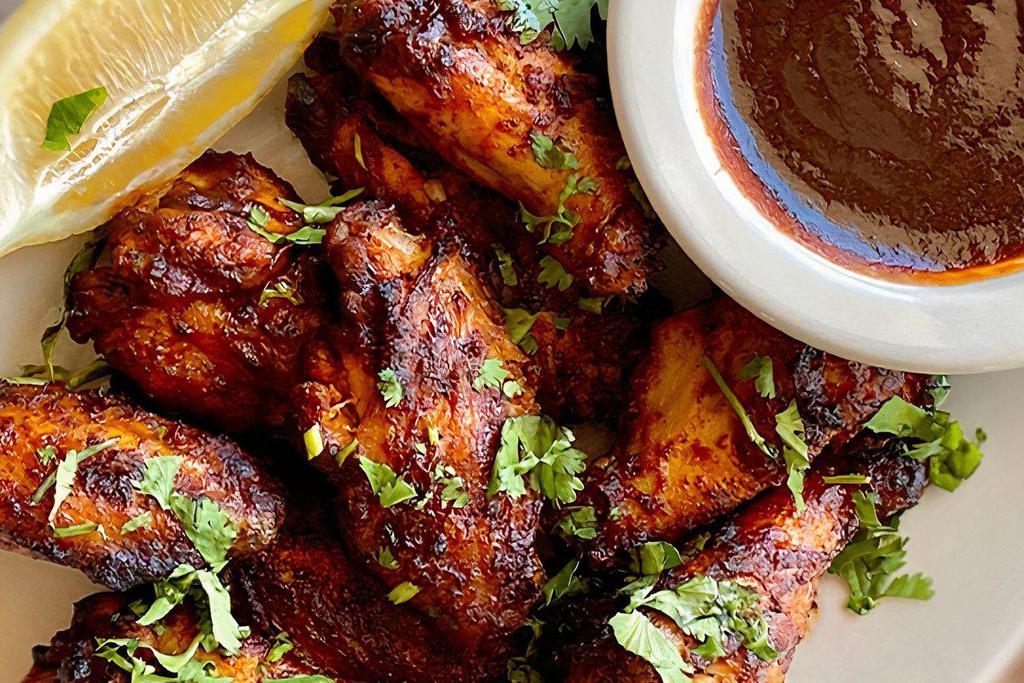 BBQ STYLE CHICKEN WINGS · Served with your choice of cool ranch, spicy buffalo ranch, or creamy blue cheese dipping sauce