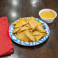 A10. Tortilla Chips with Cheddar Cheese Sauce · Thinly sliced and crispy. 