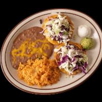 2 Sopes · Thick corn tortilla topped with beans, shredded beef, shredded chicken, or ground beef, cabb...