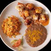 Camaron Filete · Shrimp wrapped in bacon, topped with mild sauce and melted Jack cheese. Served with rice and...