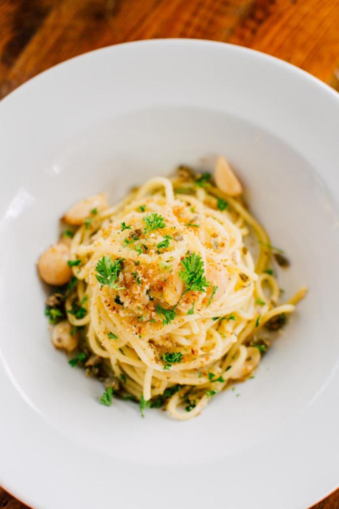 Aglio & Olio (Vegan) · Organic roasted garlic and parsley tossed in olive oil. Topped with sourdough breadcrumbs and Szechuan-infused olive oil. Vegan.