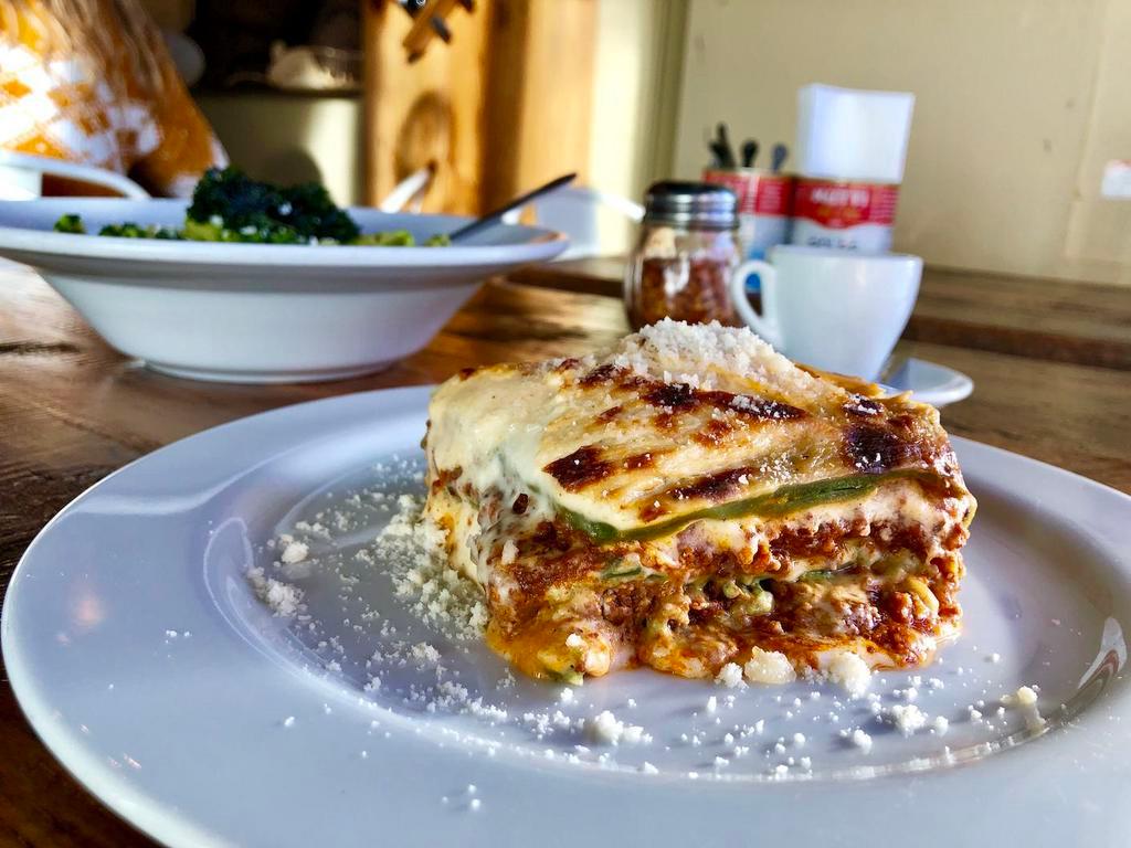 Lasagna alla Bolognese · Traditional bolognese sauce and homemade bechamel layered in egg dough pasta and baked in the oven.