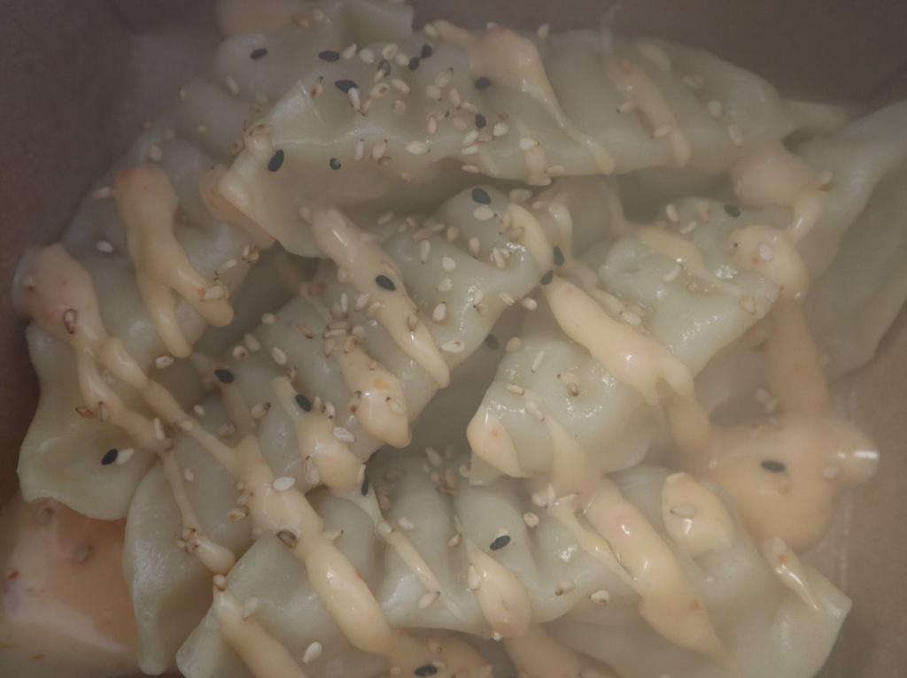 Shrimp Dumpling · 5 pieces. Steamed.
( Yum Yum Mayo, Sesame Seed on Top )