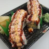 White Dragon Roll · (fully cooked)
Imitation Crab, Avocado, Cream Cheese topped with Crab Salad, Yum Yum Mayo, S...