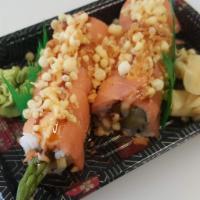 Wrap & Roll Crunch · asparagus, avocado, carrot, cucumber, topped with smoked salmon, sushi sauce, yum yum mayo, ...