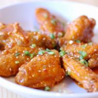 Sweet and Spicy Wings · Drums and flats tossed in our house sweet and spicy chili sauce. (6 pieces)