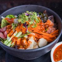 Koy Poke Bowl · Raw. Assorted sashimi, mixed greens, white rice, tobiko, onion, radish, carrots, sesame and ...
