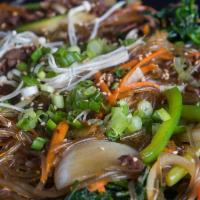 Japchae · Stir-fried Korean glass noodles, marinated beef bulgogi and seasonal vegetables.