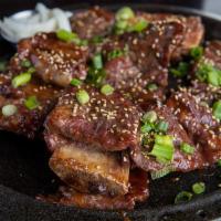 Galbi Korean BBQ · Korean style bone-in short ribs, soy sauce and brown sugar marinade,  pickled daikon radish ...