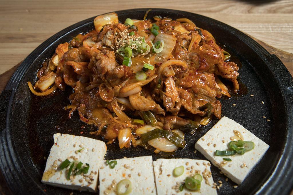 Pork Belly Korean BBQ · Pulled pork belly, grilled kimchi, sesame, steamed tofu served with white rice. Spicy!