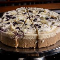 Blueberry White Chocolate Cheesecake · 1 slice, served with blueberry puree + whipped cream
