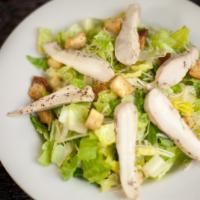 Caesar Salad · Romaine lettuce, homemade caesar dressing, Parmesan & garlic croutons.