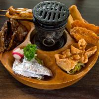 Pu Pu Platter · Assorted appetizers with two pieces of egg roll, two pieces of fried shrimp, two pieces of p...