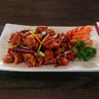 Tangerine · Lightly braised meat of your choice sauteed in a sweet and pungent sauce. Served with steame...
