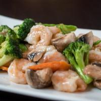 Imperial Shrimp · Shrimps sauteed with broccoli, mushrooms, snow peas and carrots in a garlic white sauce. Ser...